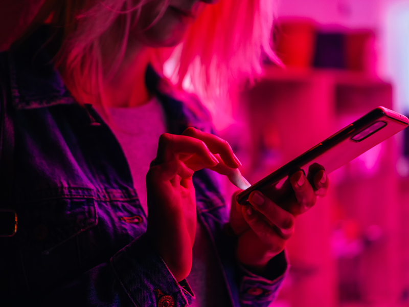 Woman using open banking on her phone